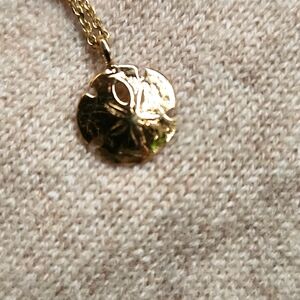 Gold sand dolar charm